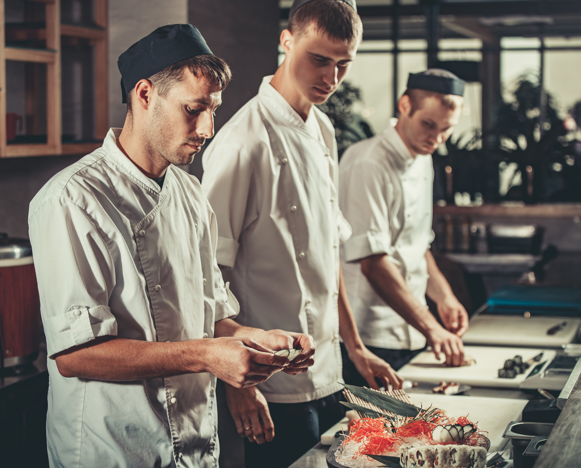 Chef and technician calibrating equipment